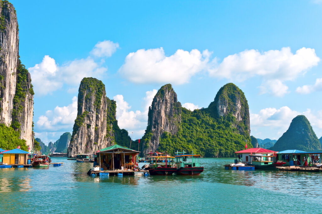 Rock islands and floating village in Halong Bay, Vietnam, Southeast Asia